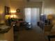 Bright living room with sectional sofa and patio access at 5757 W Eugie Ave # 2078, Glendale, AZ 85304