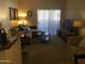 Bright living room with sectional sofa and patio access at 5757 W Eugie Ave # 2078, Glendale, AZ 85304