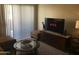 Cozy living room with sectional sofa and large TV at 5757 W Eugie Ave # 2078, Glendale, AZ 85304