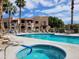 Relaxing community spa and pool area with lounge chairs at 5757 W Eugie Ave # 2078, Glendale, AZ 85304