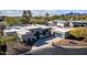 Luxury home with contemporary architecture, a large driveway, and lush landscaping at 5818 N 45Th St, Phoenix, AZ 85018