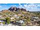 Aerial view of a residential area with mountain views, showing a house with a pool at 5818 N 45Th St, Phoenix, AZ 85018