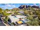 Aerial view of single-story home with desert landscaping, mountain backdrop, and circular driveway at 5818 N 45Th St, Phoenix, AZ 85018