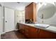 Double vanity bathroom with modern wood cabinets and updated fixtures at 5818 N 45Th St, Phoenix, AZ 85018