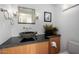 Elegant bathroom with a stone sink, dark vanity, and modern fixtures at 5818 N 45Th St, Phoenix, AZ 85018