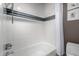 Clean bathroom with a bathtub, shower, and tiled walls at 5818 N 45Th St, Phoenix, AZ 85018