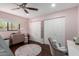 bedroom with pink walls, ample closet space, and a playful rug at 5818 N 45Th St, Phoenix, AZ 85018