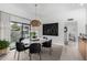 Modern dining room with round table and stylish light fixture at 5818 N 45Th St, Phoenix, AZ 85018