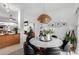 Bright dining room features a round marble table with black leather chairs at 5818 N 45Th St, Phoenix, AZ 85018