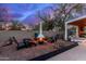 Cozy fire pit area with comfortable seating, perfect for outdoor gatherings at 5818 N 45Th St, Phoenix, AZ 85018