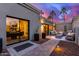 Relaxing patio with seating area, potted plants, and view into dining area at 5818 N 45Th St, Phoenix, AZ 85018