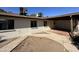 Backyard with covered patio, storage shed, and large grassy area at 6131 N 36Th Dr, Phoenix, AZ 85019