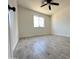 Well-lit bedroom with wood-look tile flooring and a ceiling fan at 6131 N 36Th Dr, Phoenix, AZ 85019