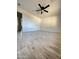 Well-lit bedroom, featuring wood-look tile flooring and a ceiling fan at 6131 N 36Th Dr, Phoenix, AZ 85019