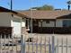 Brick house with a 2-car garage and a white picket fence at 6131 N 36Th Dr, Phoenix, AZ 85019