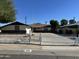 Front view of a ranch style home with a white picket fence at 6131 N 36Th Dr, Phoenix, AZ 85019