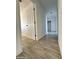 Clean hallway with light gray floors and white doors at 6131 N 36Th Dr, Phoenix, AZ 85019