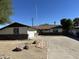 Ranch-style home with brick facade, attached garage, and a paved driveway at 6131 N 36Th Dr, Phoenix, AZ 85019