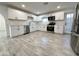 Bright kitchen, featuring white cabinets and stainless steel appliances at 6131 N 36Th Dr, Phoenix, AZ 85019