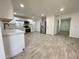 Bright kitchen boasts stainless steel appliances and wood-look tile flooring at 6131 N 36Th Dr, Phoenix, AZ 85019