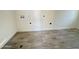 Laundry room with gray tile floors and plumbing hookups at 6131 N 36Th Dr, Phoenix, AZ 85019