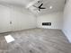 Living room with vaulted ceiling, ceiling fan and built in fireplace at 6131 N 36Th Dr, Phoenix, AZ 85019