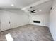 Living room with vaulted ceiling, ceiling fan and built in fireplace at 6131 N 36Th Dr, Phoenix, AZ 85019