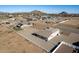 Aerial view of a house with a large backyard, white fence, and neighboring houses at 6608 N Cima Vista Dr, Casa Grande, AZ 85194