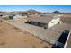 Aerial view showcasing the home's backyard, a white fence, and surrounding landscape at 6608 N Cima Vista Dr, Casa Grande, AZ 85194