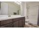 Bathroom with double vanity and bathtub shower combo at 6608 N Cima Vista Dr, Casa Grande, AZ 85194