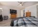 Spacious bedroom with wood-look floors and ceiling fan at 6608 N Cima Vista Dr, Casa Grande, AZ 85194