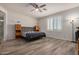 Main bedroom with wood-look floors and ensuite bathroom at 6608 N Cima Vista Dr, Casa Grande, AZ 85194