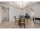 Bright dining area with chandelier and modern table and chairs at 6608 N Cima Vista Dr, Casa Grande, AZ 85194