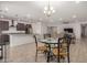 Open dining room with chandelier and glass-top dining table at 6608 N Cima Vista Dr, Casa Grande, AZ 85194