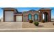 Single-story home with a large garage and landscaped front yard at 6608 N Cima Vista Dr, Casa Grande, AZ 85194