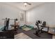 Home gym with exercise equipment, including a stationary bike and weights at 6608 N Cima Vista Dr, Casa Grande, AZ 85194