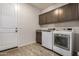 Laundry room with washer, dryer, and built-in cabinets at 6608 N Cima Vista Dr, Casa Grande, AZ 85194