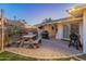 Outdoor patio with picnic table, grill, and string lights at 6627 N 16Th Dr, Phoenix, AZ 85015