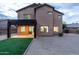 Two-story house with covered patio, artificial turf, and gravel backyard at 6909 N 71St Dr, Glendale, AZ 85303