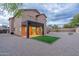 Two-story house with covered patio, artificial turf, and gravel backyard at 6909 N 71St Dr, Glendale, AZ 85303