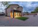 Two-story house with covered patio, artificial turf, and gravel backyard at 6909 N 71St Dr, Glendale, AZ 85303