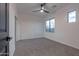 Bright bedroom featuring carpet, ceiling fan and window at 6909 N 71St Dr, Glendale, AZ 85303