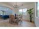 Modern dining room with light hardwood floors and a stylish chandelier at 6909 N 71St Dr, Glendale, AZ 85303