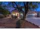 Two-story house with a two-car garage and landscaped front yard at 6909 N 71St Dr, Glendale, AZ 85303