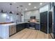 Modern kitchen with stainless steel appliances and quartz countertops at 6909 N 71St Dr, Glendale, AZ 85303