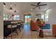 Modern kitchen with island, pendant lights, and breakfast bar at 6909 N 71St Dr, Glendale, AZ 85303