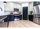 Modern kitchen with stainless steel appliances and a pantry at 6909 N 71St Dr, Glendale, AZ 85303