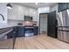 Modern kitchen with stainless steel appliances and a pantry at 6909 N 71St Dr, Glendale, AZ 85303