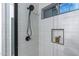 Modern shower with gray tile and built-in shelf at 6909 N 71St Dr, Glendale, AZ 85303