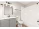 Updated bathroom with gray vanity, bathtub and toilet at 7118 E Arbor Ave, Mesa, AZ 85208